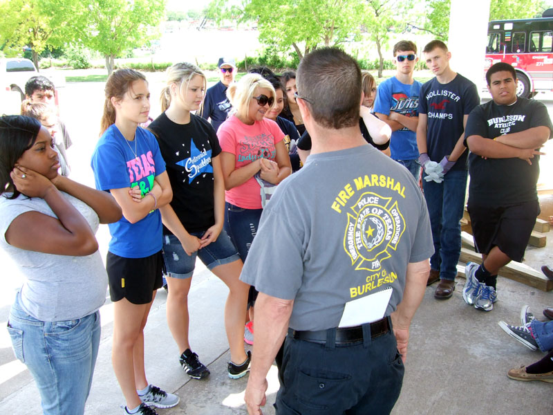 Photo of teens performing training duties